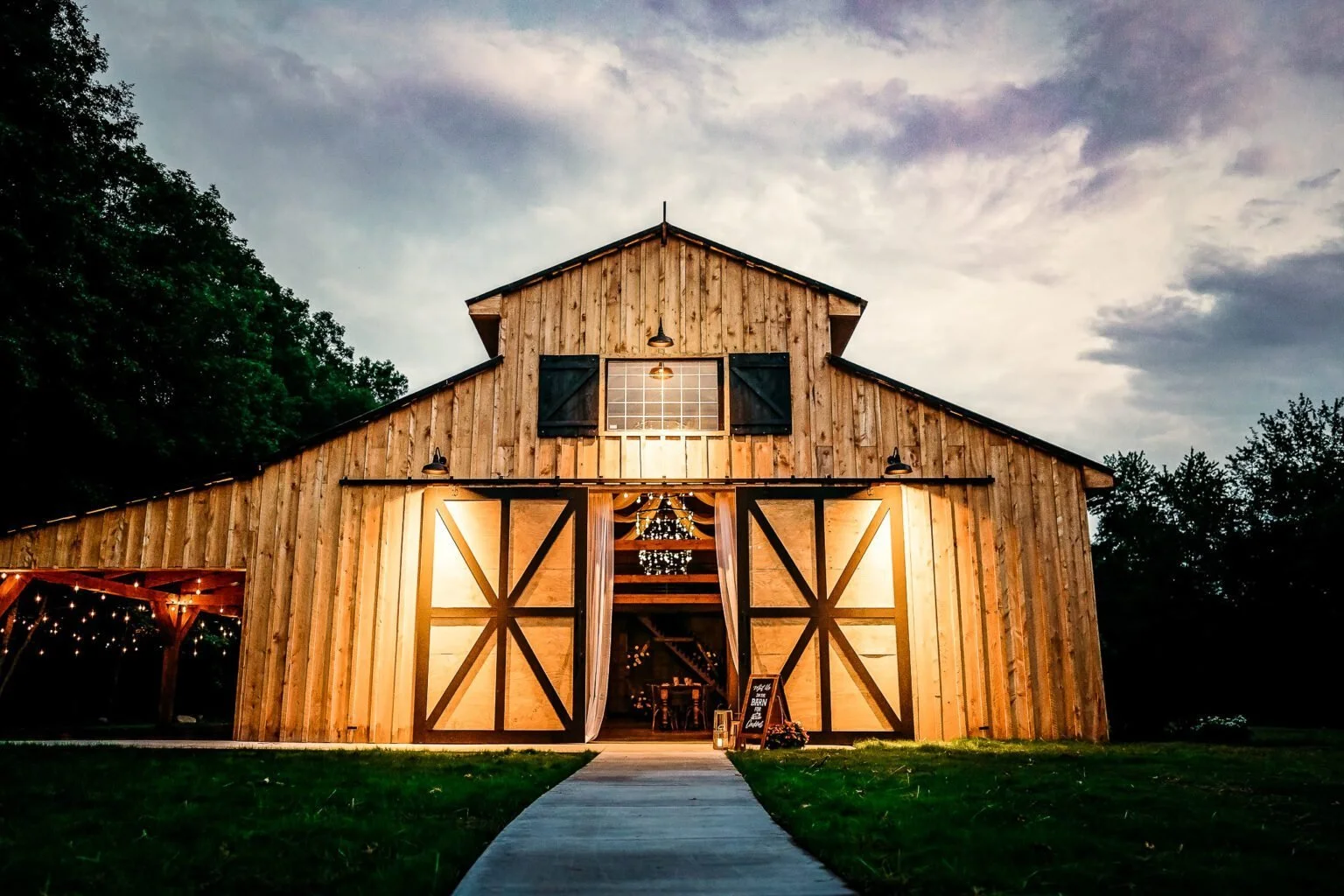  If you’ve always dreamed of a gorgeous rustic wedding, then the barn at Pleasantly Devine Stables is for you. This 100-plus acre of secluded beauty surrounded by nature offers a pond, aged tree line views, and lots more. It can be the perfect backdrop for your private country wedding.  Other details couples love at this venue include the hilltop, which is great for your first look. The grounds offer many options for your wedding day photography, including a wooded theme. You’ll also love the patio and the fire pit.&nbsp;  The Rustic Barn at Pleasantly Devine Stables is a versatile and exclusive venue that can host up to 150 guests. You are sure to have an unforgettable celebration when you choose this space. Whether your dream is for a small and intimate gathering or a luxurious one, this venue has got you covered.&nbsp; 