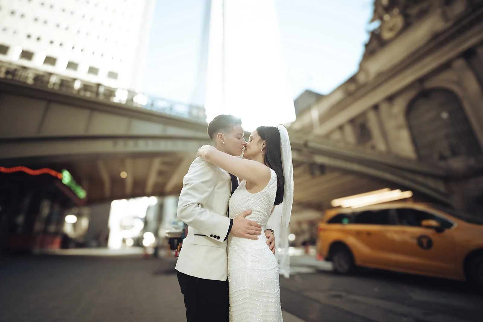  Cassandra and Nicole standing outside of Grand Central Station during their NYC anniversary session 