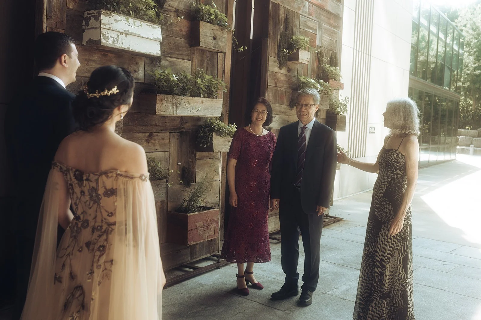  Brooklyn wedding photographer captures family first look moment at 1 Hotel Brooklyn Bridge with parents seeing couple in wedding attire 
